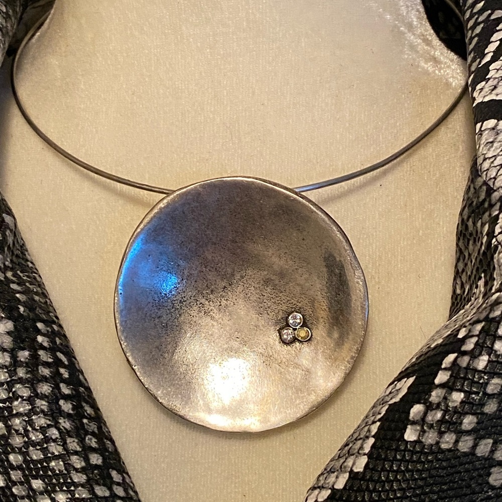 Fantastic Round Pendant on neckwire.